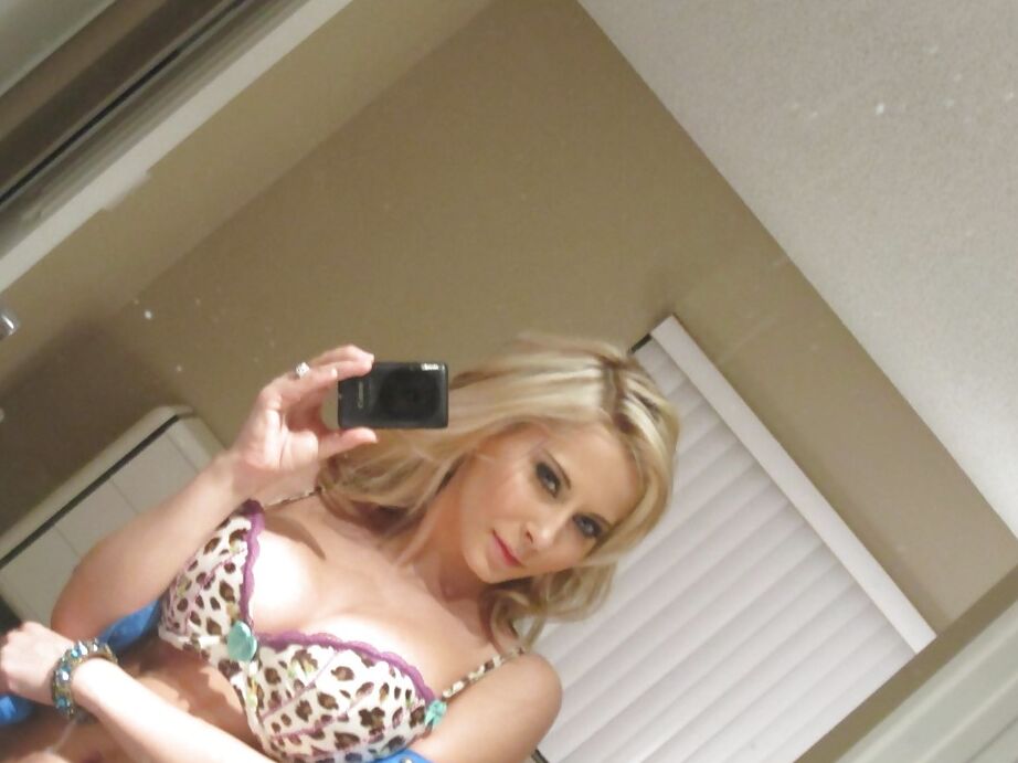 16P Busty blonde Madison Ivy taking mirror selfies while removing animal print bra