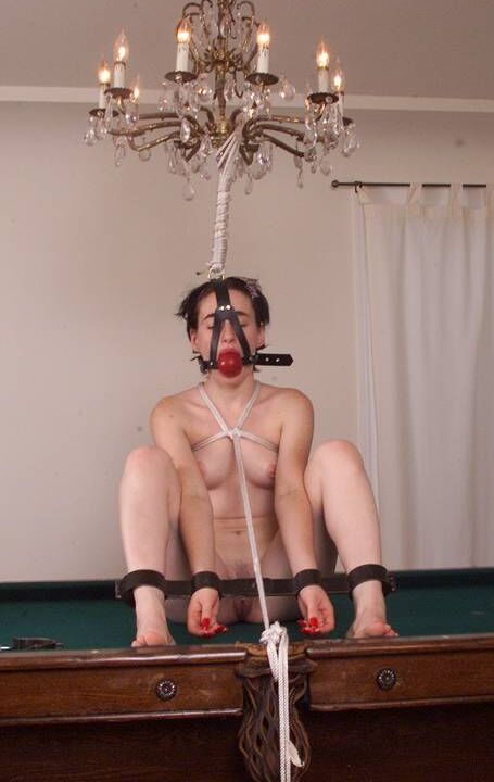 18P Naked brunette Dani getting tied up on a pool table while ball-gagged