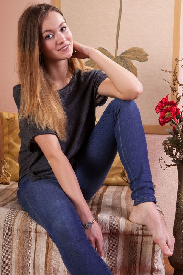 18P Fully clothed model Solveig shedding denim jeans to pose in the nude
