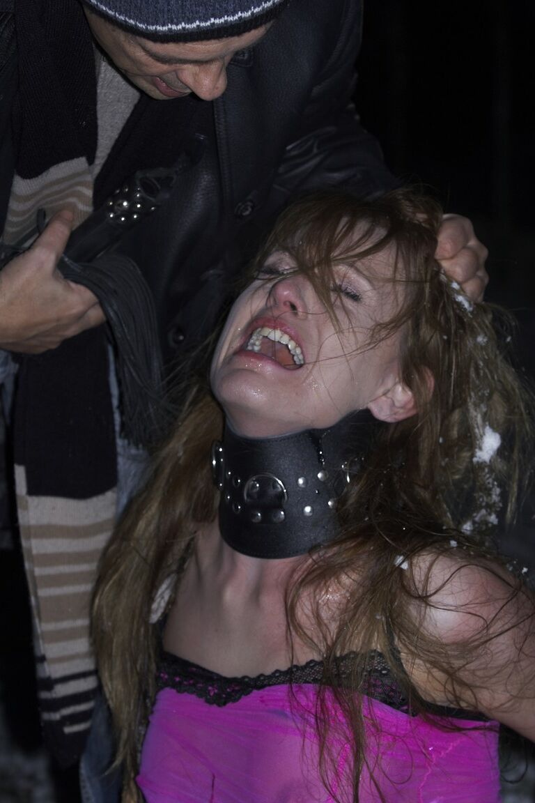 17P Collar bound white girl Olga Barz is whipped raw in the nude on snowy ground