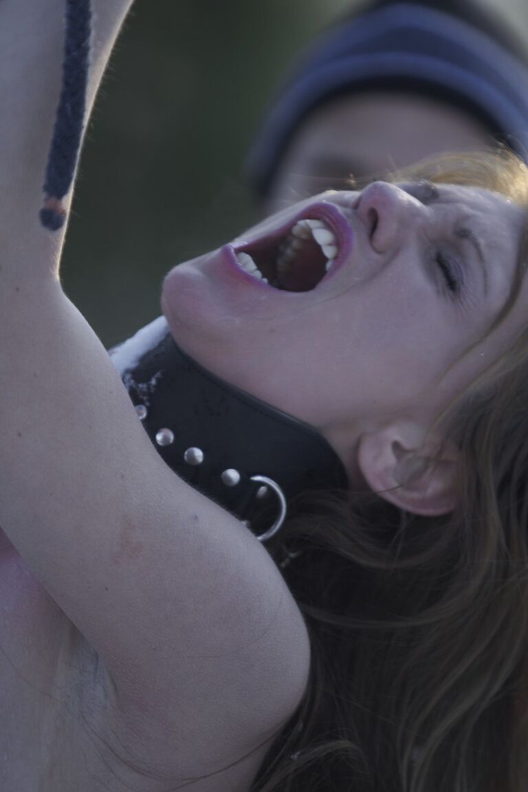 17P Collar bound white girl Olga Barz is whipped raw in the nude on snowy ground