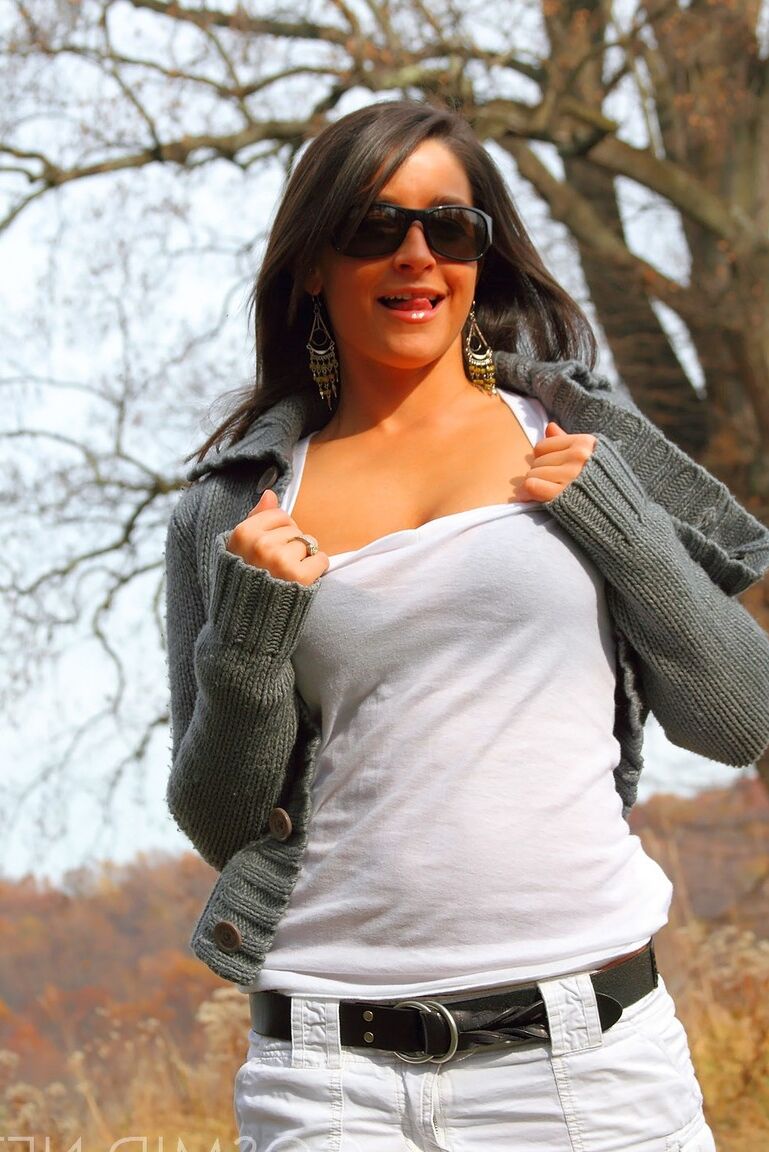 16P Amateur model strips to her underwear while climbing a scrubby tree