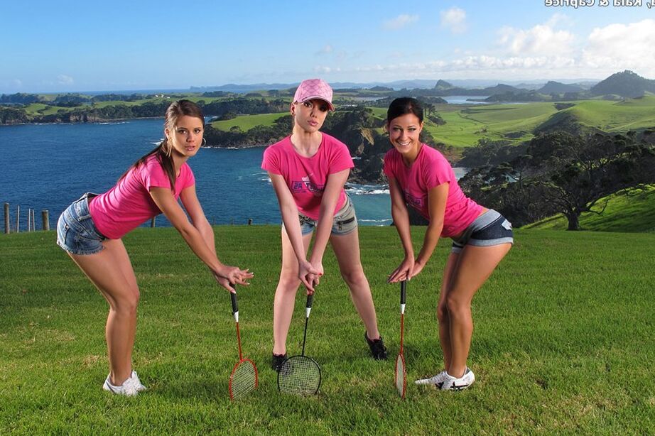 15P Three girls expose their perfect asses while playing badminton on a lawn