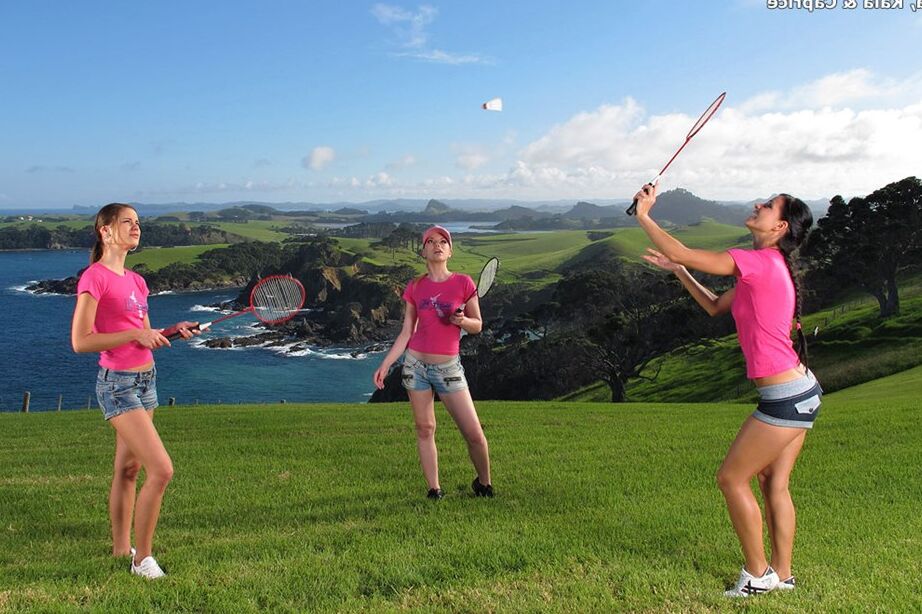 15P Three girls expose their perfect asses while playing badminton on a lawn