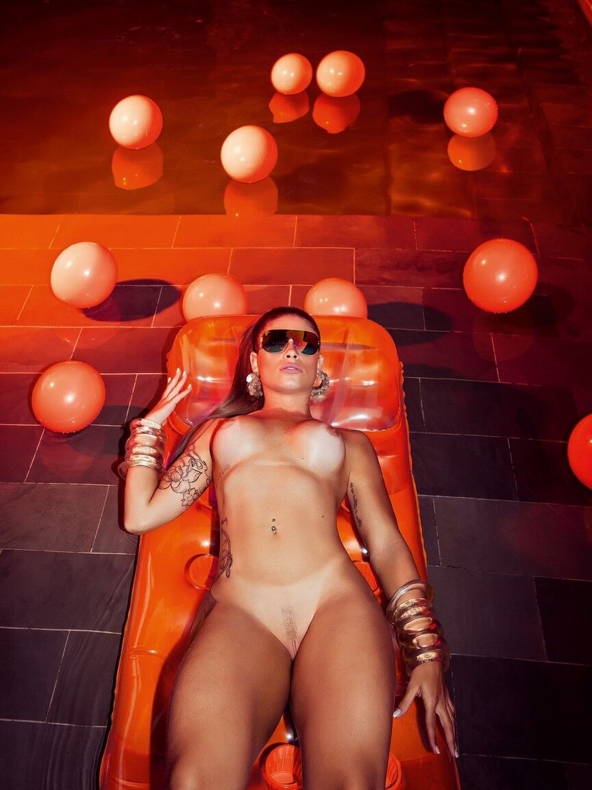 12P Tatted girl Rita Mattos shows her hot ass while posing for a centerfold shoot