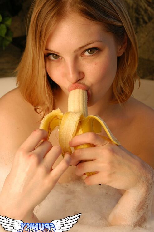 12P Teen first timer Danielle eats a banana while soaking in a bathtub