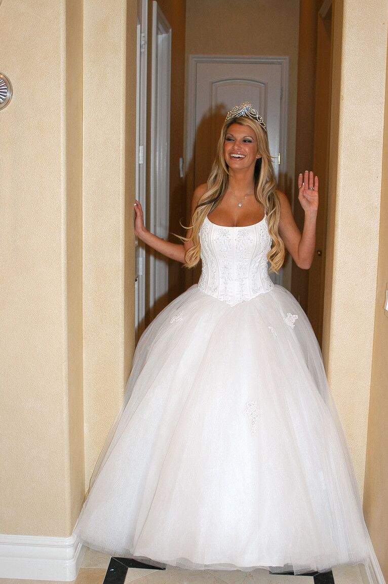 17P Gorgeous bride Kendall Brooks teases with plentiful cleavage in wedding gown