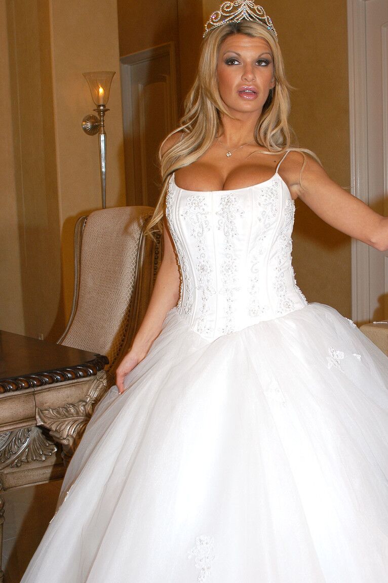 17P Gorgeous bride Kendall Brooks teases with plentiful cleavage in wedding gown