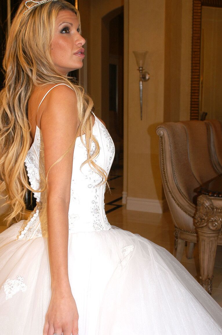 17P Gorgeous bride Kendall Brooks teases with plentiful cleavage in wedding gown