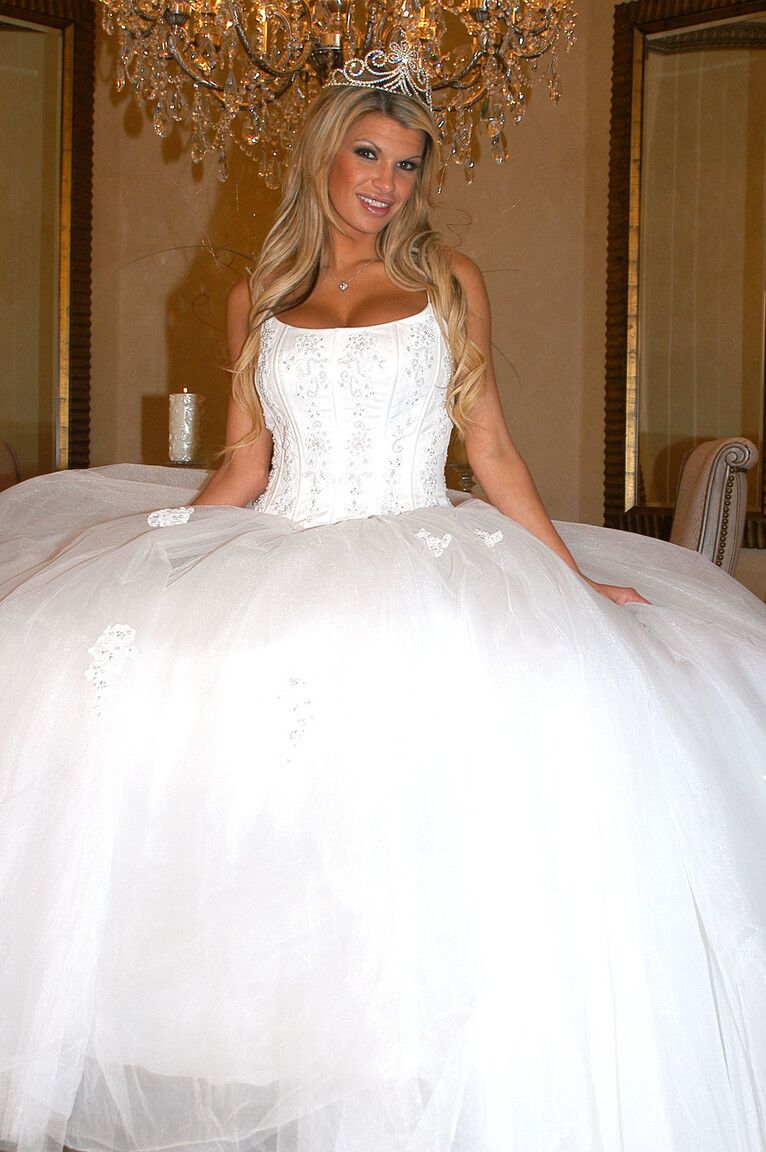 17P Gorgeous bride Kendall Brooks teases with plentiful cleavage in wedding gown