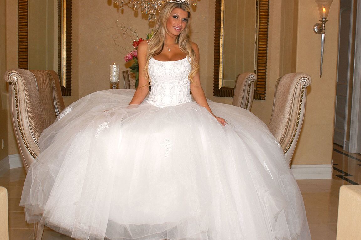 17P Gorgeous bride Kendall Brooks teases with plentiful cleavage in wedding gown