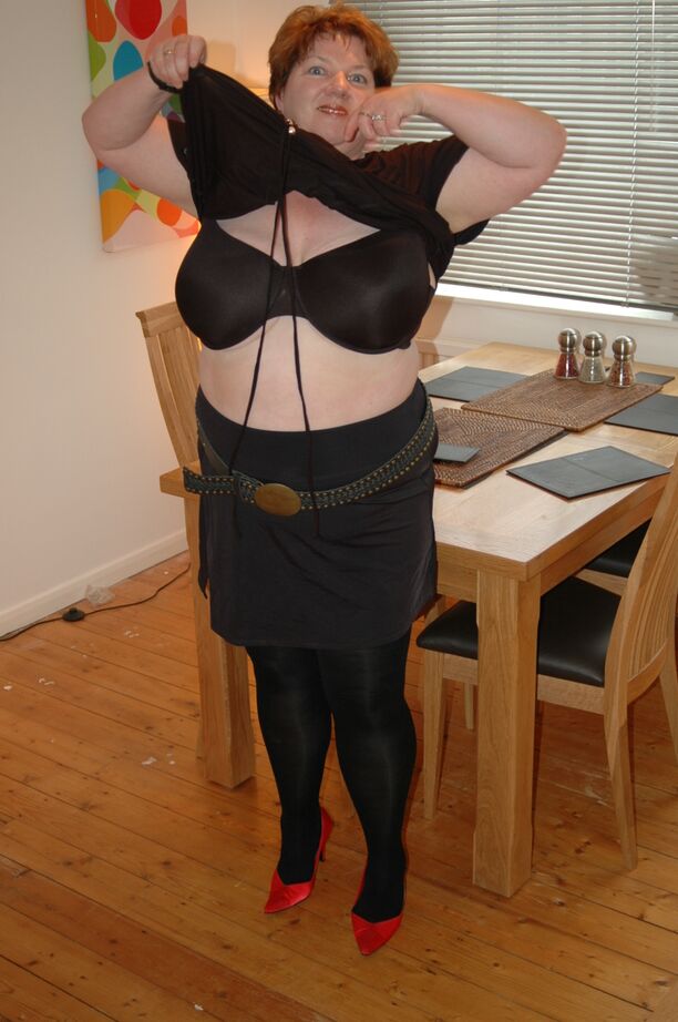 20P Redhead fatty Chris 44g bares a large boob before freeing her cunt from hose