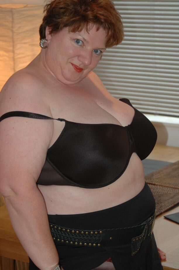 20P Redhead fatty Chris 44g bares a large boob before freeing her cunt from hose