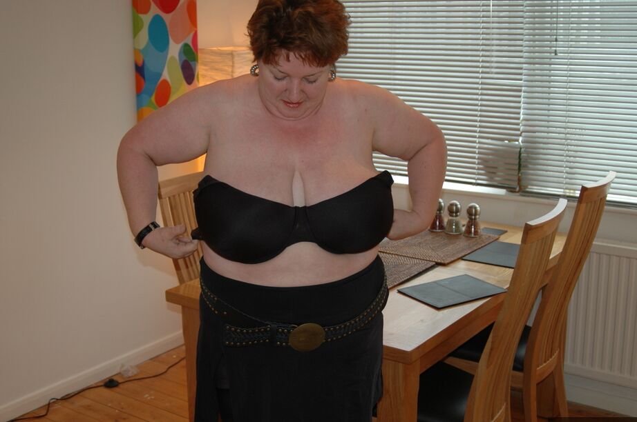20P Redhead fatty Chris 44g bares a large boob before freeing her cunt from hose