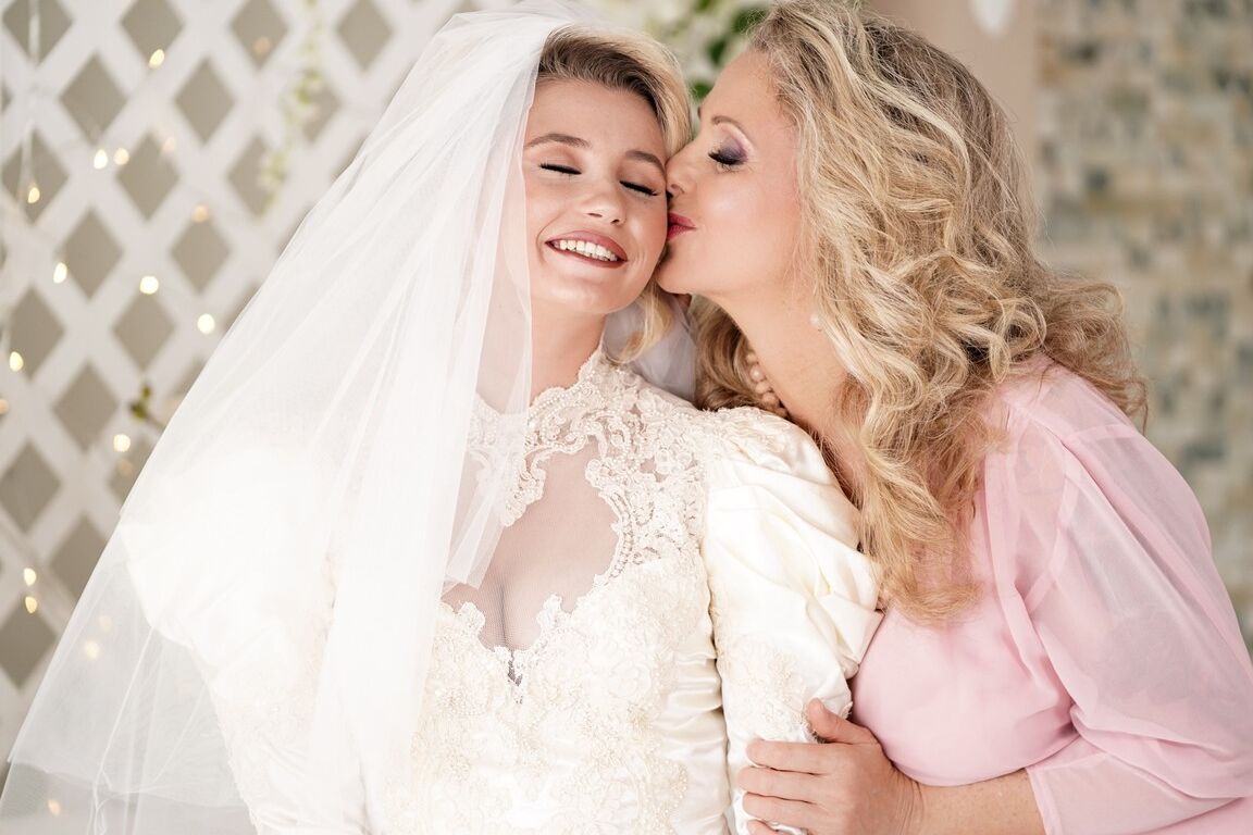 15P Carolina Sweets is affixed with a garter before a lesbian wedding to Julia Ann