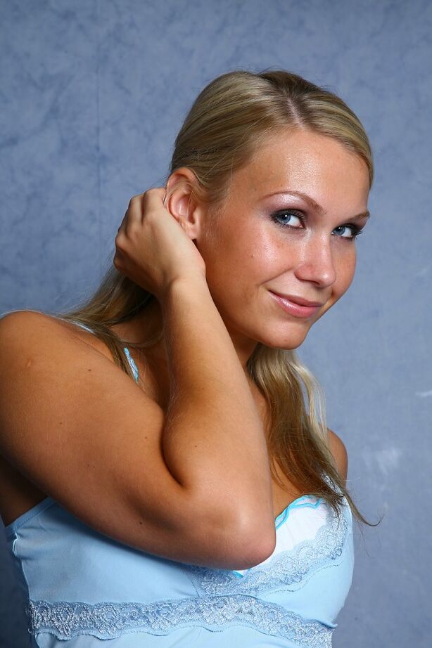 21P Blonde honey with a tanned body Mischa rubs her twat after stripping