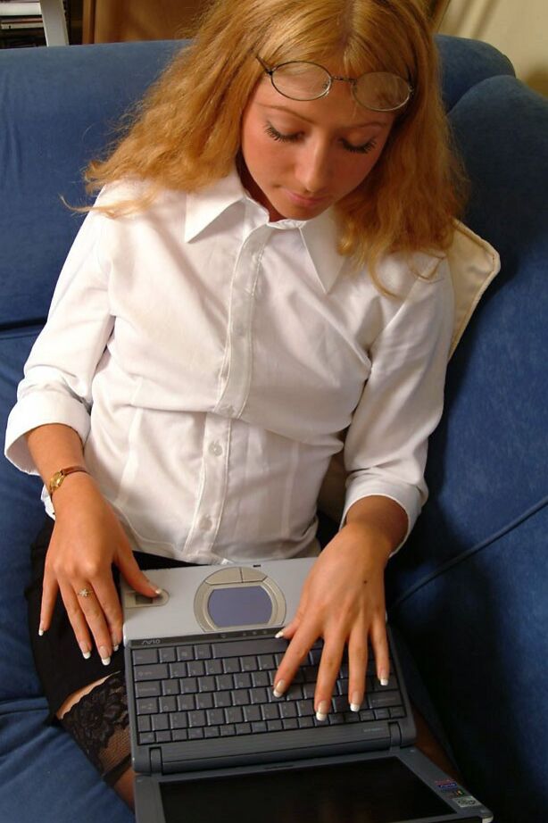 21P British secretary Lana strips to her stockings after doing work on the laptop
