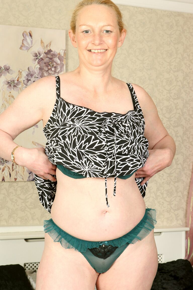 21P British lady with a ponytail Suzie Stone rubs her huge natural tits