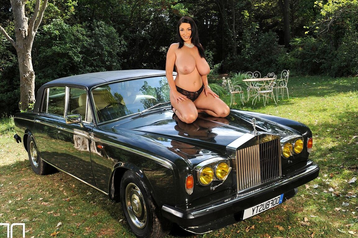 21P Black haired MILF Michelle Monaghan lets out her grand bosom on a luxury car