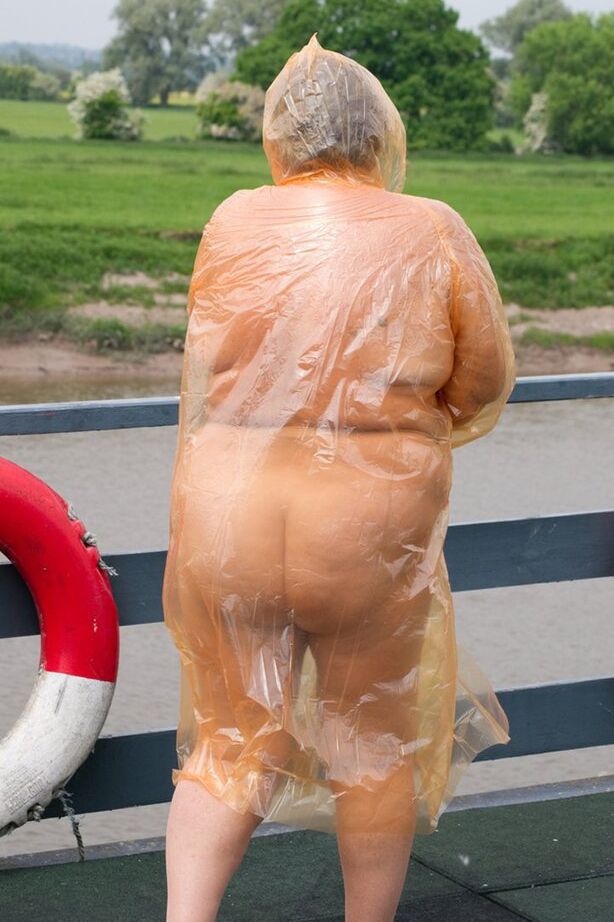 20P Obese oma Grandma Libby doffs a see-through raincoat to get naked on a bridge