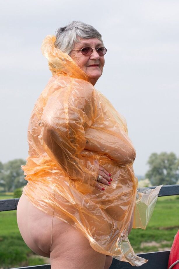 20P Obese oma Grandma Libby doffs a see-through raincoat to get naked on a bridge