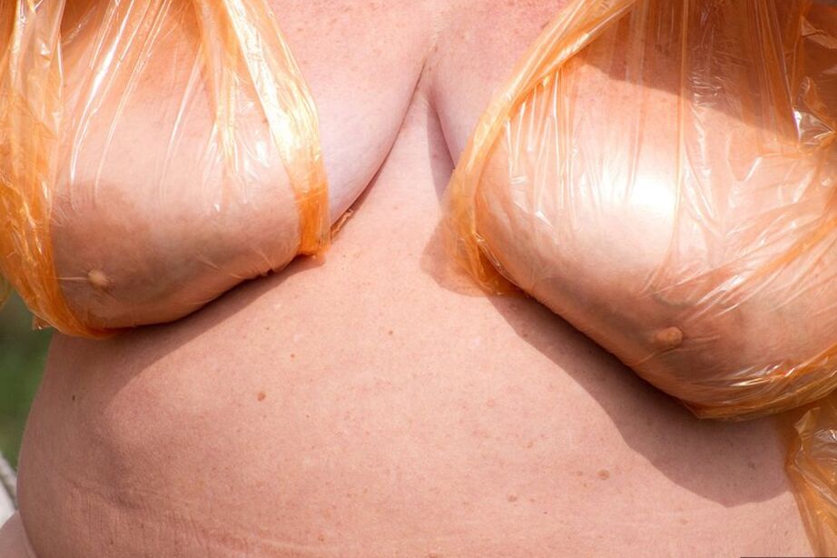 20P Obese oma Grandma Libby doffs a see-through raincoat to get naked on a bridge