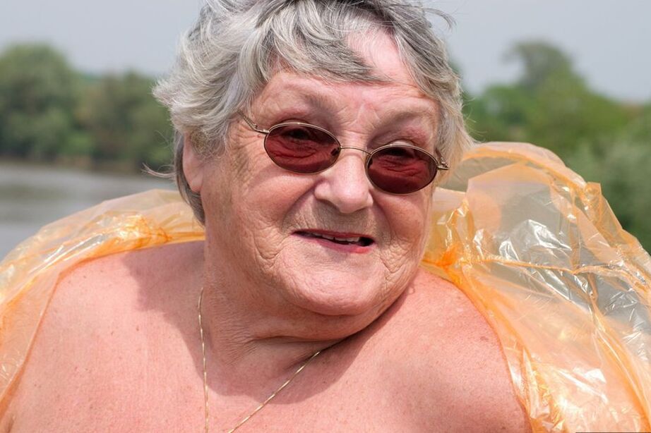 20P Obese oma Grandma Libby doffs a see-through raincoat to get naked on a bridge