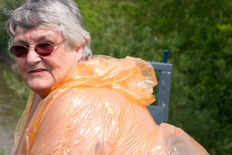 20P Obese oma Grandma Libby doffs a see-through raincoat to get naked on a bridge