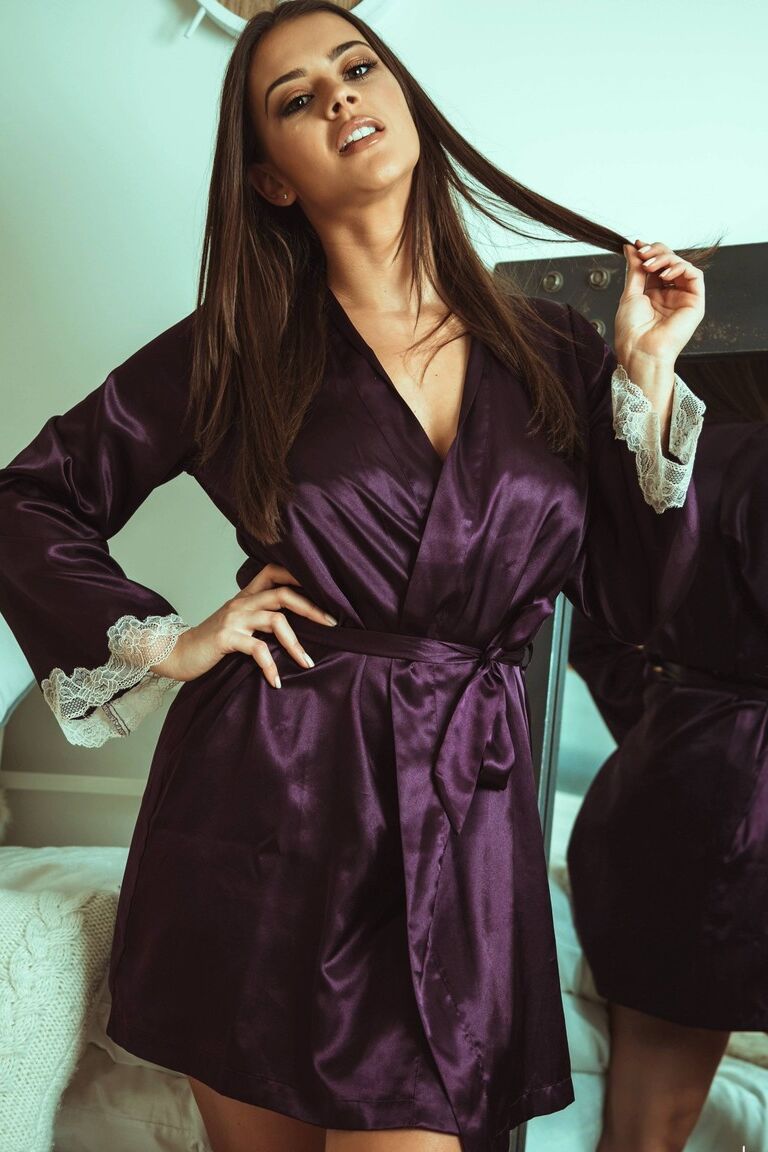 12P British beauty Brook Wright removes a satin robe to get naked on her bed