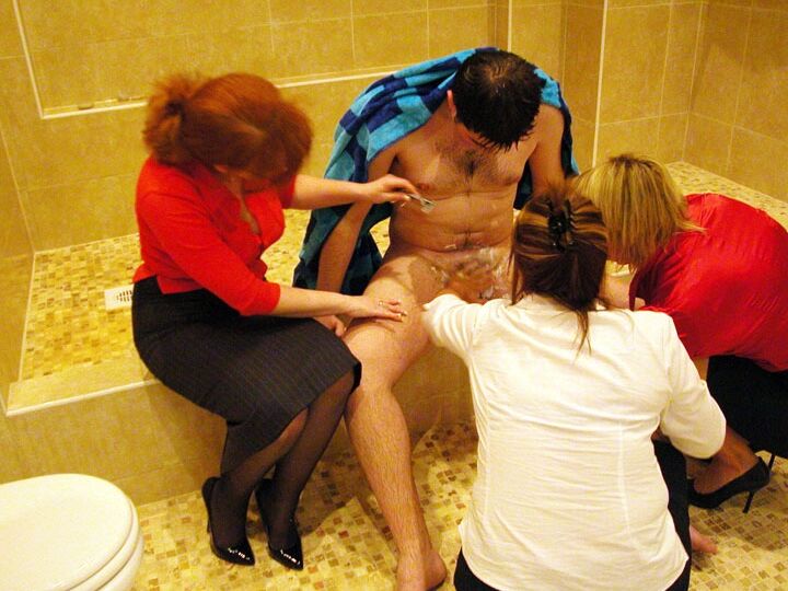 21P Mature ladies in skirts play with a naked guy's tasty dong in the toilet