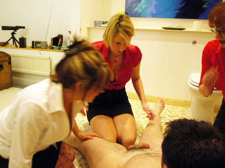 21P Mature ladies in skirts play with a naked guy's tasty dong in the toilet