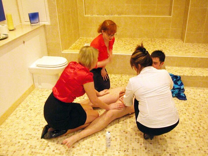 21P Mature ladies in skirts play with a naked guy's tasty dong in the toilet