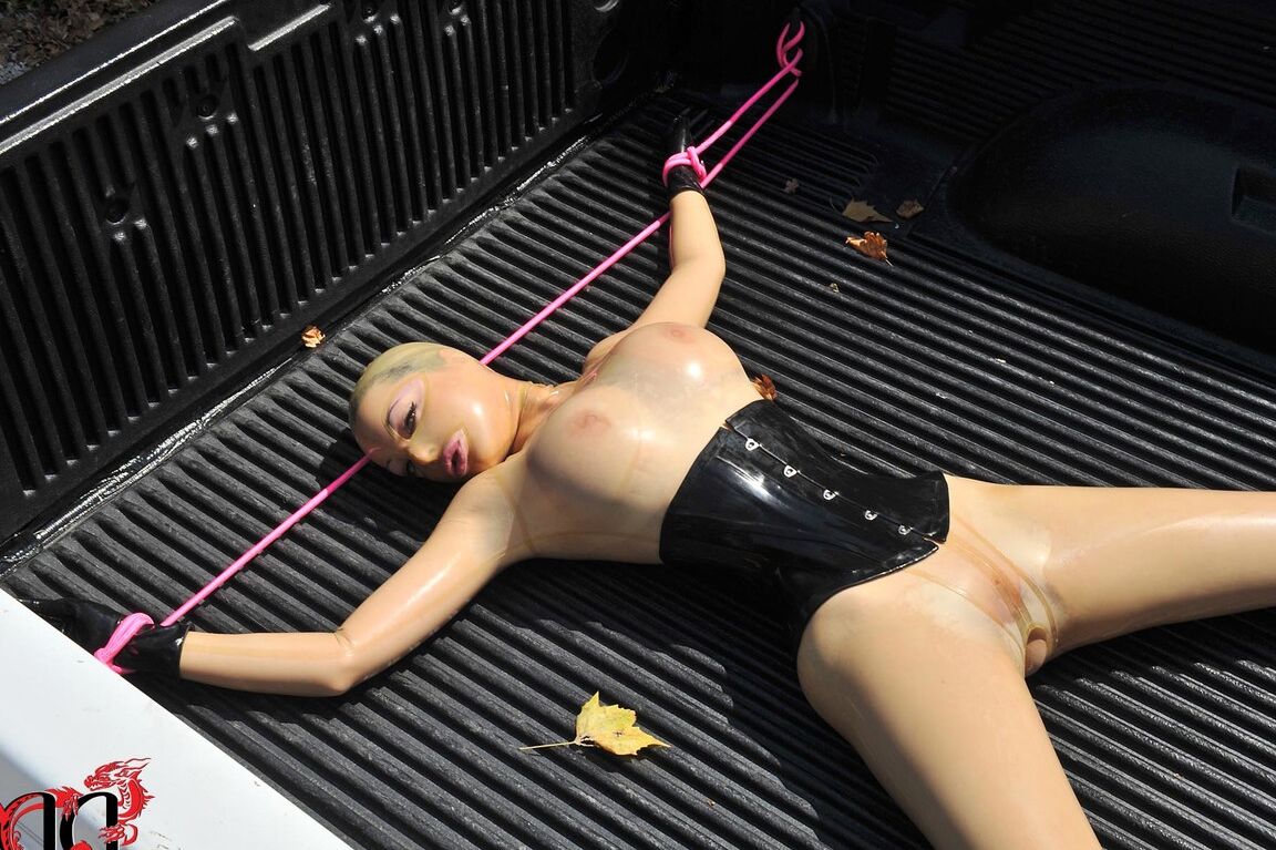 21P British girl in latex Latex Lucy gets tied on a truck & water jetted in BDSM