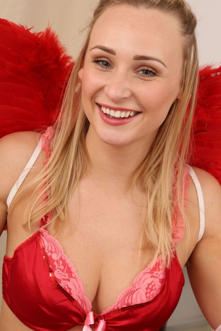 21P Charming devil Rachel May strips provocatively and poses in exotic lingerie