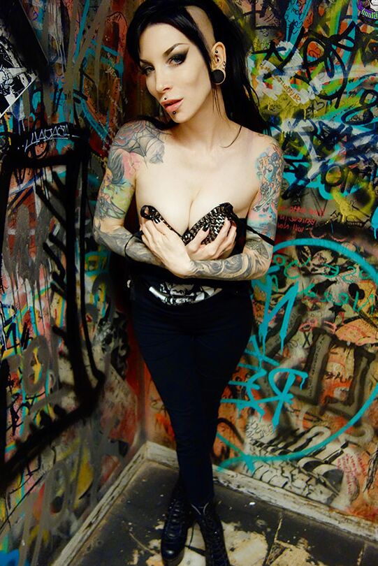 15P Goth girl Razor Candi strips to OTK boots in graffiti filled bathroom