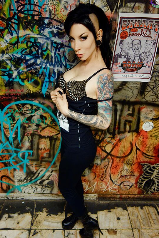 15P Goth girl Razor Candi strips to OTK boots in graffiti filled bathroom