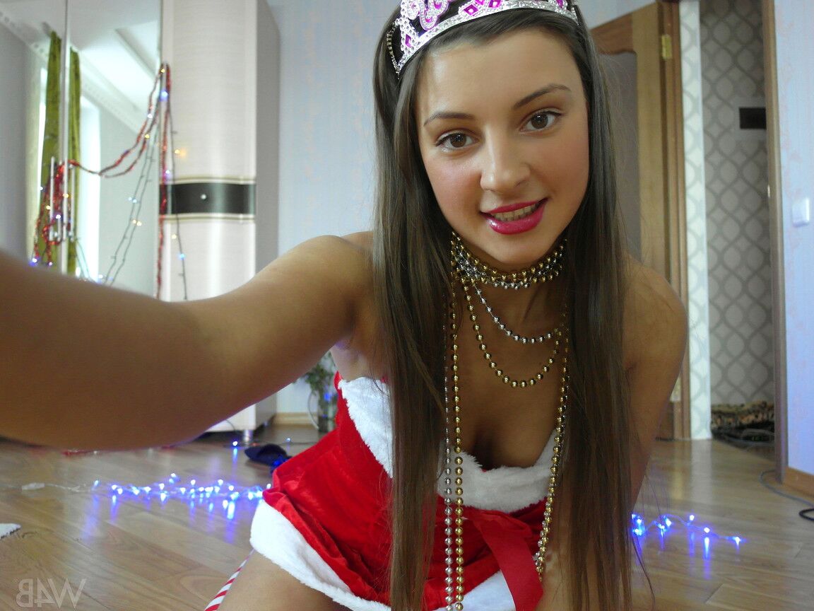 20P Pretty girl in a Xmas cap Maria shows her twat up close and toys it