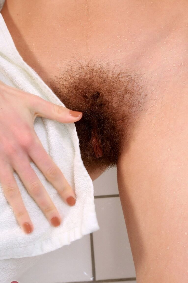 21P Brunette with small tits plays with her hairy beaver and masturbates in a tub