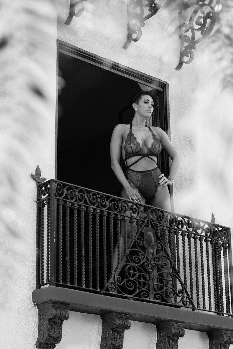 17P Hypnotizing brunette Sunny Leone in exciting black lingerie on the balcony