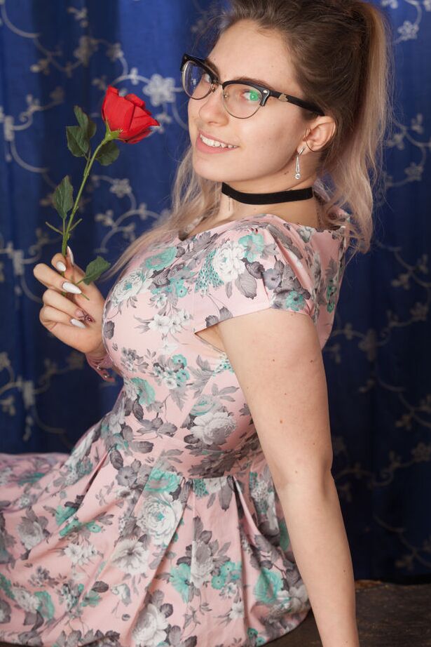16P Nerdy 18 year old Liza Loo holds a rose showing her firm breasts in glasses