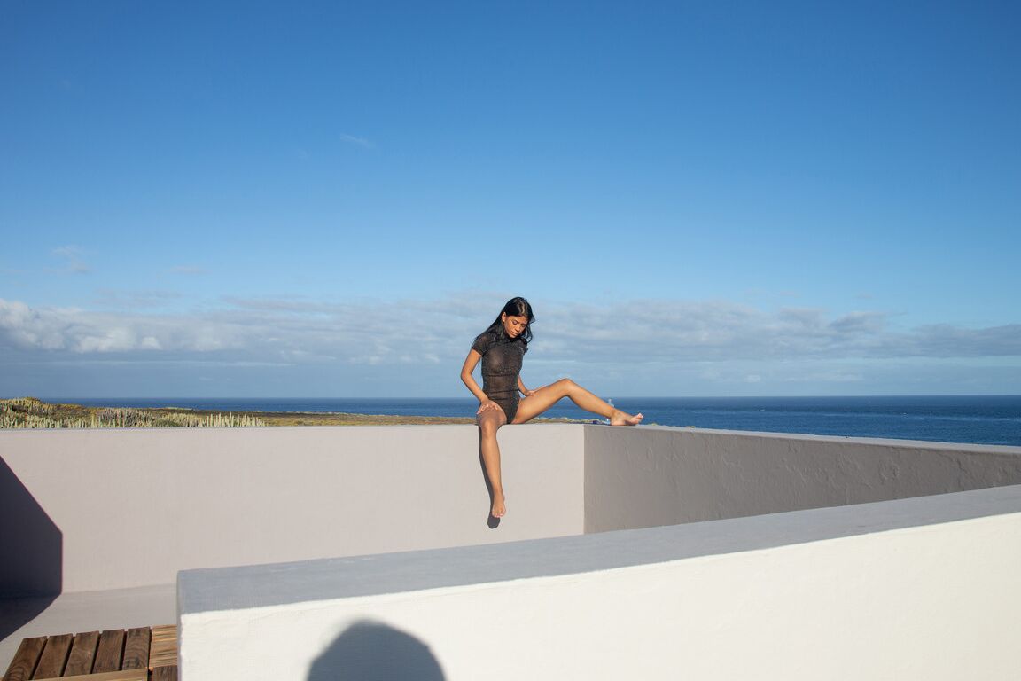 21P Small titted Latina Karin Torres exposes her fine body & poses on the balcony