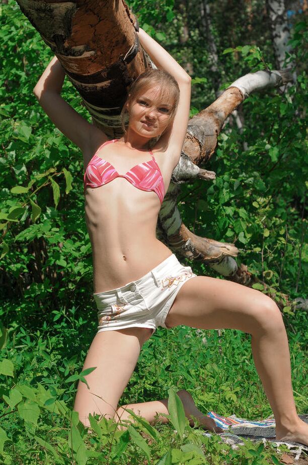 18P Petite teenage looker Bridgit strips down in the middle of the woods