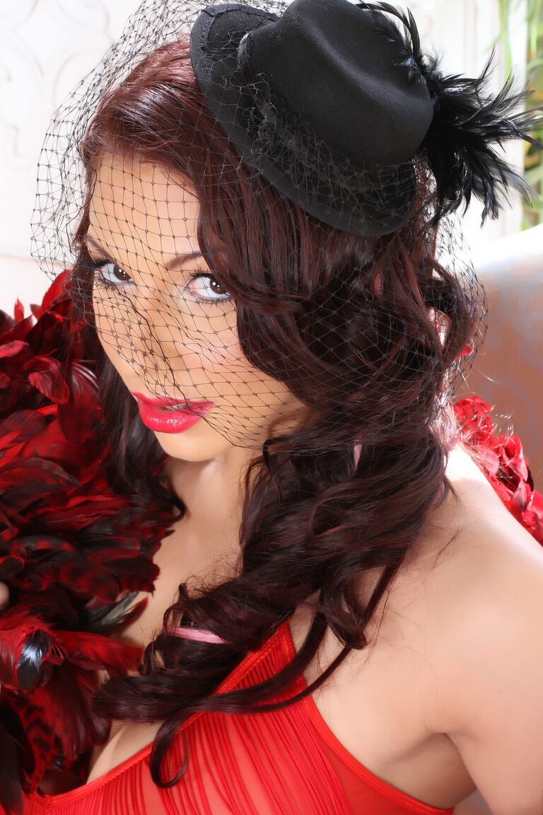 21P Slutty widow Lylith LaVey shows her killer curves in red lingerie and strips