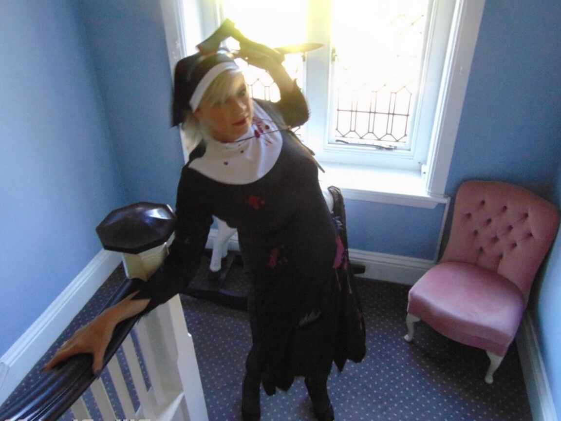 16P Mature amateur Dimonty removes a nun outfit while riding a hobbyhorse