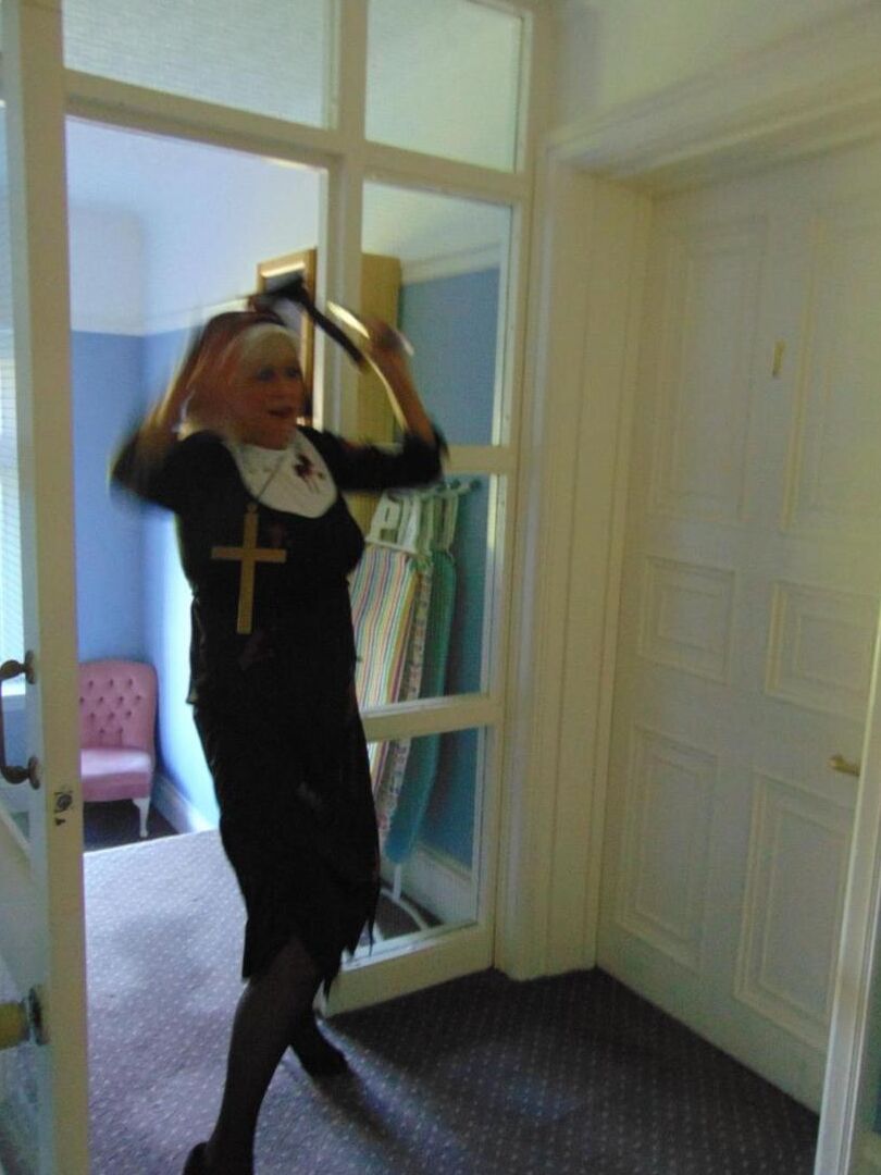 16P Mature amateur Dimonty removes a nun outfit while riding a hobbyhorse