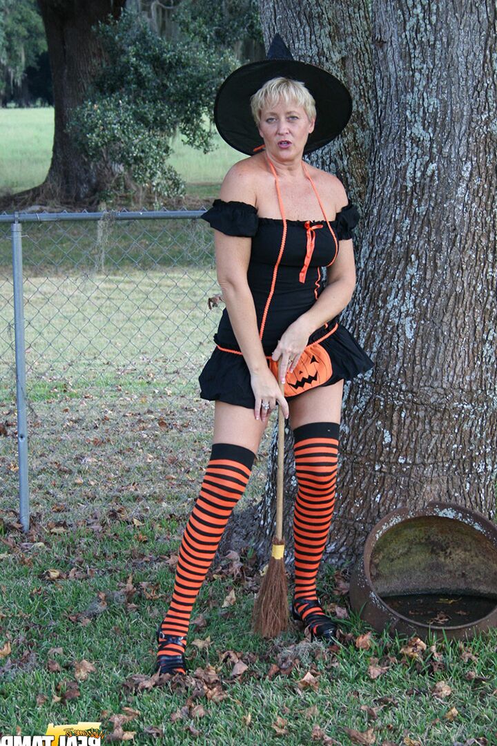 15P Older lady Tracy Lick shows her bald twat while riding broomstick in backyard