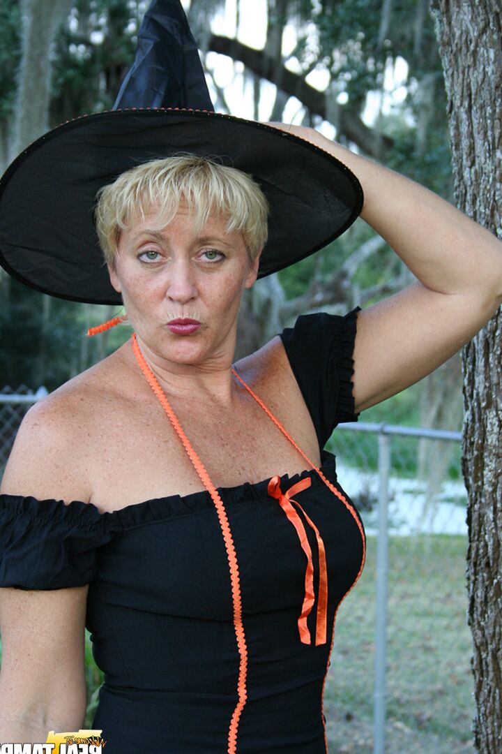 15P Older lady Tracy Lick shows her bald twat while riding broomstick in backyard