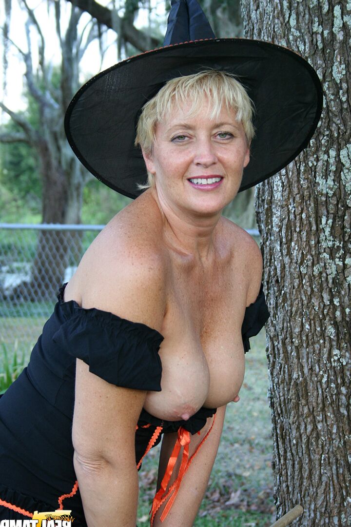 15P Older lady Tracy Lick shows her bald twat while riding broomstick in backyard