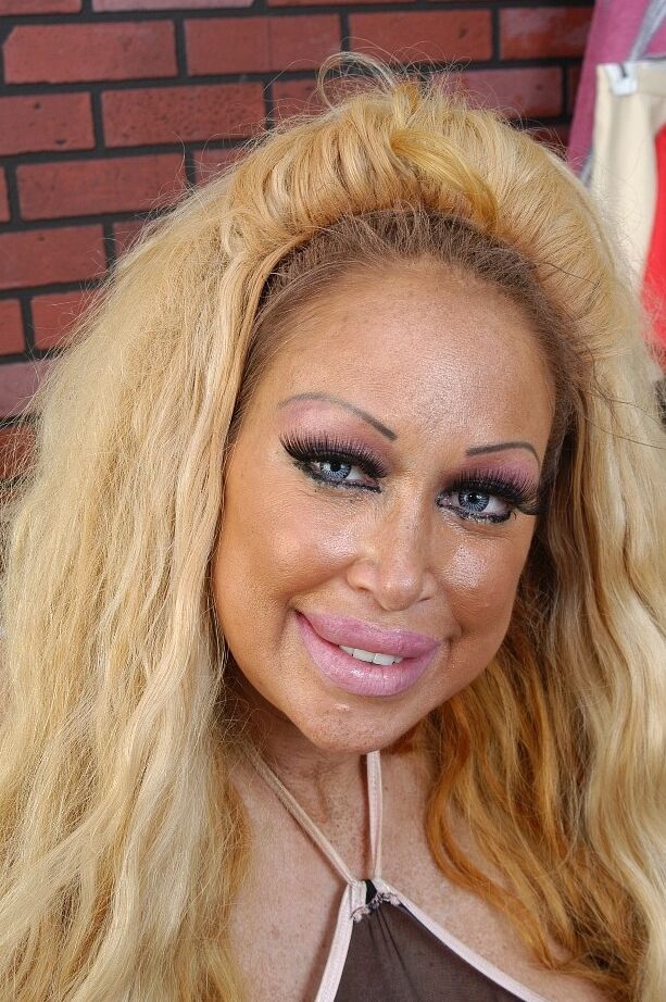 16P Buxom granny Pamela flaunting huge juggs while working out in weight room