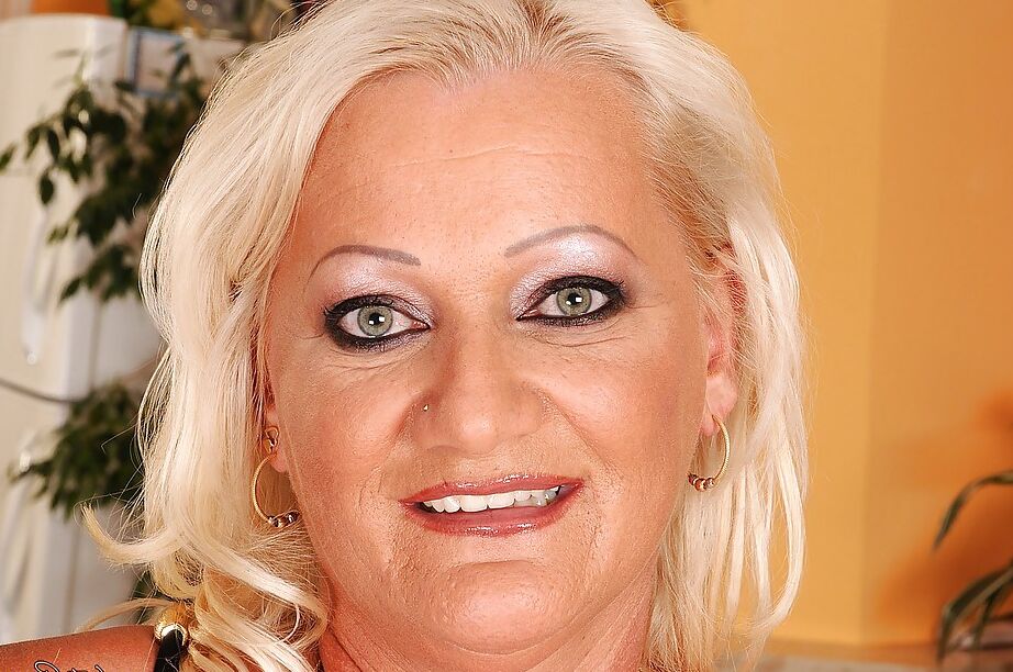 16P Buxom granny stripping and showing off her shaved gloryhole